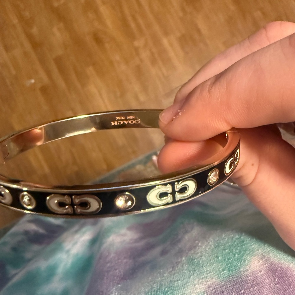 NWOT Coach Black and Gold Logo Bracelet Signature Enamel Hinged Bangle